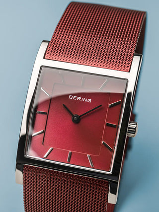 Angle shot of Bering 10426-303-S Red Dial Stainless Steel Womens Watch on white background