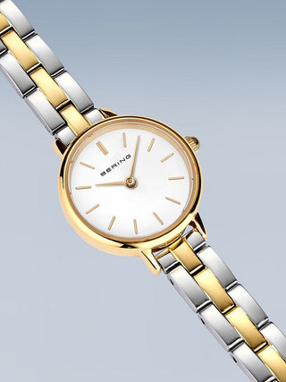 Angle shot of Bering 11022-714 White Dial Gold Stainless Steel Womens Watch on white background