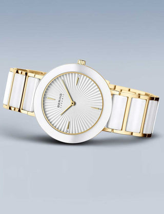 Angle shot of Bering 11435-758 White Dial Gold Stainless Steel Womens Watch on white background