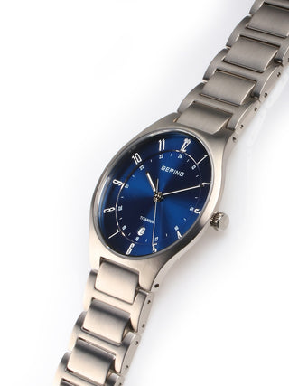 Angle shot of Bering 11739-707 Blue Dial Silver Titanium Unisex Watch on white background