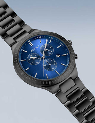 Angle shot of Bering Chronograph 11743-727 Blue Dial Black Titanium Unisex Watch on white background