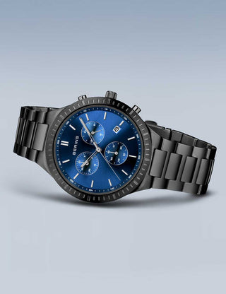 Angle shot of Bering Chronograph 11743-727 Blue Dial Black Titanium Unisex Watch on white background