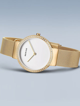 Angle shot of Bering 14531-330 White Dial Gold Stainless Steel Womens Watch on white background