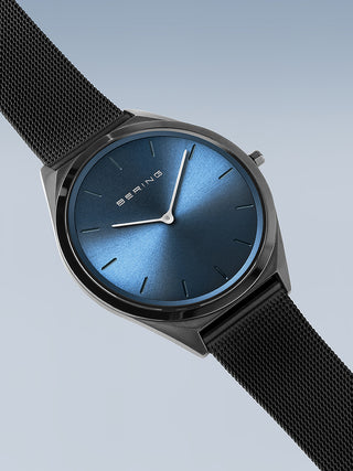 Angle shot of Bering 17039-227 Blue Dial Black Stainless Steel Unisex Watch on white background