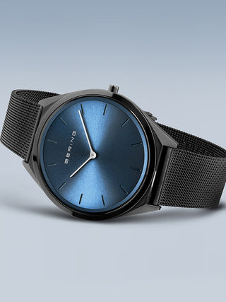 Angle shot of Bering 17039-227 Blue Dial Black Stainless Steel Unisex Watch on white background