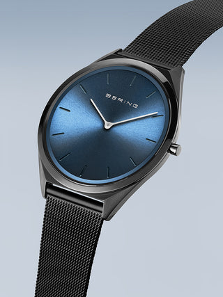 Angle shot of Bering 17039-227 Blue Dial Black Stainless Steel Unisex Watch on white background