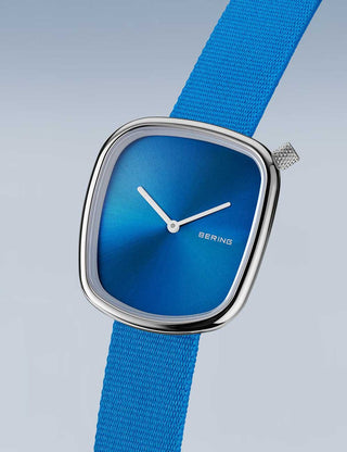 Angle shot of Bering 18034-308 Blue Textile Womens Watch on white background