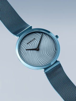 Angle shot of Bering 18132-CHARITY2 Blue Stainless Steel Womens Watch on white background