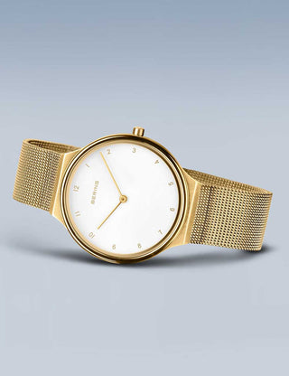 Angle shot of Bering 18434-334 White Dial Gold Stainless Steel Womens Watch on white background