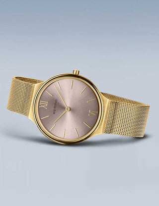 Angle shot of Bering 18434-336 Pink Dial Gold Stainless Steel Womens Watch on white background