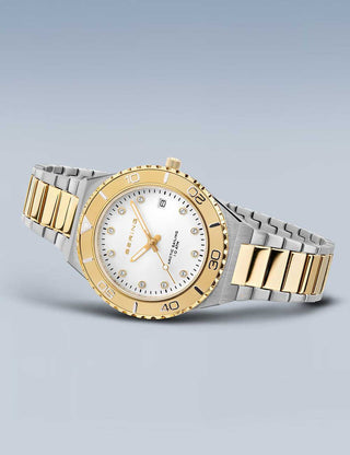 Angle shot of Bering 18936-710 White Dial Gold Stainless Steel Womens Watch on white background