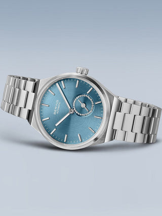 Angle shot of Bering 19435-CHARITY Blue Dial Silver Stainless Steel Womens Watch on white background