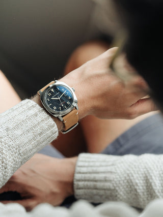 Angle shot of Spinnaker SP-5071-01 Black Dial Brown Leather Unisex Watch on white background