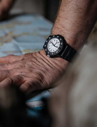 Angle shot of Luminox XS.3007.EVO.S White Dial Black Strap Unisex Watch on white background